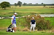 1 September 2024; Pauline Roussin-Bouchard of France consults her caddie Paul Keyser before playing from the rough on the 18th fairway during the play-off in the final round of the KPMG Women’s Irish Open at Carton House Golf Club in Maynooth, Kildare. Photo by Sam Barnes/Sportsfile