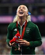 3 September 2024; Orla Comerford of Ireland celebrates with her bronze medal from the women's T13 100m final on day six of the Paris 2024 Paralympic Games at Stade de France in Paris, France. Photo by Harry Murphy/Sportsfile