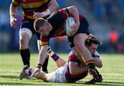 7 September 2024; Jack Treanor of Lansdowne is tackled by Tadhg Bird of Clontarf during the Bank of Ireland Leinster Senior Cup final match between Lansdowne RFC and Clontarf RFC at Energia Park in Dublin. Photo by Tom Beary/Sportsfile