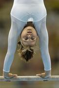 19 August 2004; Anna Pavlova of Russia goes through her routine on the Uneven bars during the Women's Individual All Round Final in Artistic Gymnastics. Olympic Indoor Hall. Games of the XXVIII Olympiad, Athens Summer Olympics Games 2004, Athens, Greece. Picture credit; Brendan Moran / SPORTSFILE