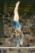 19 August 2004; Marine Debauve of France goes through her routine on the Uneven bars in the Women's Individual All Round Final in Artistic Gymnastics. Olympic Indoor Hall. Games of the XXVIII Olympiad, Athens Summer Olympics Games 2004, Athens, Greece. Picture credit; Brendan Moran / SPORTSFILE