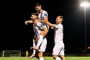 13 September 2024; Adam Foley of Drogheda United celebrates with team-mates Luke Heeney, centre, and Matthew O'Brien, right, after scoring their side's fourth goal during the Sports Direct Men's FAI Cup Quarter Final match between Athlone Town and Drogheda United at Athlone Town Stadium in Westmeath. Photo by Piaras Ó Mídheach/Sportsfile