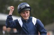 14 September 2024; Jockey Tom Marquand celebrates after winning the Royal Bahrain Irish Champion Stakes on Economics during day one of the Irish Champions Festival at Leopardstown Racecourse in Dublin. Photo by Seb Daly/Sportsfile