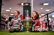 14 September 2024; Derry City supporters Daithí Dunne, age 5, and his sister Éireanna, age 6, at the Sports Direct Men’s FAI Cup Trophy Tour at Sports Direct, Derry, ahead of the Sports Direct Men’s FAI Cup Quarter Final Mtch between Derry City and Shelbourne at the Ryan McBride Brandywell Stadium in Derry. Photo by Ben McShane/Sportsfile