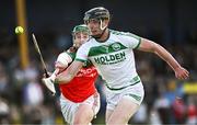 15 September 2024; Darragh Corcoran of Shamrocks Ballyhale in action against Niall Mullins of James Stephens during the Kilkenny Senior Hurling Championship Relegation Semi-Final match between James Stephens and Shamrocks Ballyhale at John Locke Park, Callan in Kilkenny. Photo by Shauna Clinton/Sportsfile