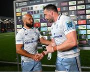 20 September 2024; Jamison Gibson-Park of Leinster, left, is presented with the man of the match award by team captain Jack Conan after the United Rugby Championship match between Edinburgh and Leinster at Hive Stadium in Edinburgh, Scotland. Photo by Seb Daly/Sportsfile