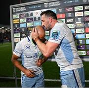 20 September 2024; Jamison Gibson-Park of Leinster, left, is presented with the man of the match award by team captain Jack Conan after the United Rugby Championship match between Edinburgh and Leinster at Hive Stadium in Edinburgh, Scotland. Photo by Seb Daly/Sportsfile