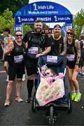 22 September 2024; Participants, from left, Sarah Irwin, Christopher Burns, Ella Burns and Nicola Grace after finishing the 2024 Irish Life Dublin Half Marathon which took place on Sunday 22nd of September in Phoenix Park, Dublin. Photo by Sam Barnes/Sportsfile