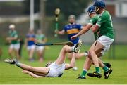 22 September 2024; Diarmaid Byrnes of Patrickswell is fouled by Pierce Connery of Kilmallock during the Limerick County Senior Club Hurling Championship Group 1 match between Patrickswell and Kilmallock at Mick Neville Park in Rathkeale, Limerick. Photo by Tom Beary/Sportsfile