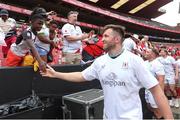 28 September 2024; Ulster captain Alan O’Connor greets a young supporter after the United Rugby Championship match between Emirates Lions and Ulster at Emirates Airline Park in Johannesburg, South Africa. Photo by Shaun Roy/Sportsfile