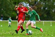 28 September 2024; Ella Kelly of Republic of Ireland in action against Lily Nicholls of Cymru during the women's U17 international friendly match between Republic of Ireland and Cymru at the AUL Complex in Clonsaugh, Dublin. Photo by Shauna Clinton/Sportsfile