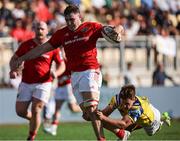 28 September 2024;  Ruadhán Quinn of Munster is tackled by Giovanni Montemauri of Zebre Parma zduring the United Rugby Championship match between Zebre Parma and Munster at Stadio Sergio Lanfranchi in Parma, Italy. Photo by Roberto Bregani/Sportsfile