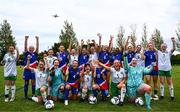 28 September 2024; Ireland and USA players pose for a group photograph after the Cerebal Palsy women's international series match between Ireland and USA at the AUL Complex in Dublin. Photo by Shauna Clinton/Sportsfile