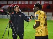 30 September 2024; St Patrick's Athletic head of media Jamie Moore interviews Al-Amin Kazeem after the SSE Airtricity Men's Premier Division match between Shelbourne and St Patrick's Athletic at Tolka Park in Dublin. Photo by Stephen McCarthy/Sportsfile