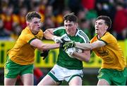 6 October 2024; Tadhg Mulligan of Mohill in action against Michael McBrien, left, and Tom Prior of Ballinamore Sean O'Heslins during the Leitrim County Senior Club Football Championship final match between Ballinamore Sean O'Heslins and Mohill at Ballinamore Sean O'Heslins GAA Club in Leitrim. Photo by Sam Barnes/Sportsfile