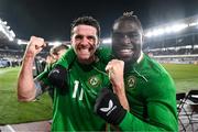 10 October 2024; Robbie Brady, left, and Festy Ebosele of Republic of Ireland celebrate after the UEFA Nations League B Group 2 match between Finland and Republic of Ireland at the Helsinki Olympic Stadium in Helsinki, Finland. Photo by Stephen McCarthy/Sportsfile