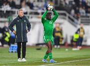 10 October 2024; Festy Ebosele of Republic of Ireland and head coach Heimir Hallgrimsson during the UEFA Nations League B Group 2 match between Finland and Republic of Ireland at the Helsinki Olympic Stadium in Helsinki, Finland. Photo by Stephen McCarthy/Sportsfile