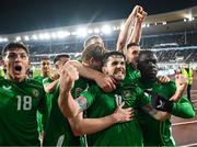 10 October 2024; Republic of Ireland Robbie Brady celebrates with team-mates including Jamie McGrath, left, and Festy Ebosele, right, after scoring their side's second goal during the UEFA Nations League B Group 2 match between Finland and Republic of Ireland at the Helsinki Olympic Stadium in Helsinki, Finland. Photo by Stephen McCarthy/Sportsfile