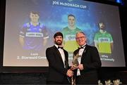 11 October 2024; Offaly hurler Ben Conneely receives his 2024 Joe McDonagh Team of the Year award from Uachtarán Chumann Lúthchleas Gael Jarlath Burns during the GAA Champion 15 Awards ceremony at Croke Park in Dublin. Photo by Sam Barnes/Sportsfile