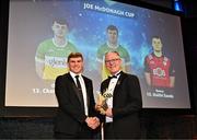 11 October 2024; Offaly hurler Brian Duignan receives his 2024 Joe McDonagh Team of the Year award from Uachtarán Chumann Lúthchleas Gael Jarlath Burns during the GAA Champion 15 Awards ceremony at Croke Park in Dublin. Photo by Sam Barnes/Sportsfile