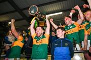 12 October 2024; Josh Moore of Rathvilly lifts the trophy after his side's victory in the Carlow County Senior Club Football Championship final replay match between Rathvilly and Palatine at Netwatch Cullen Park in Carlow. Photo by Tyler Miller/Sportsfile