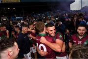 13 October 2024; Sean Michael Corcoran, 10 and Robert Pigott of Portarlington celebrate after the Laois County Senior Club Football Championship final match between Portlaoise and Portarlington at Laois Hire O'Moore Park in Portlaoise, Laois. Photo by Tom Beary/Sportsfile