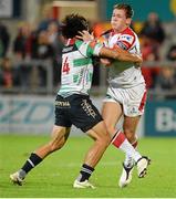 27 September 2013; Craig Gilroy, Ulster, is tackled by Ludovico Nitoglia, Benetton Treviso. Celtic League 2013/14, Round 4, Ulster v Benetton Treviso, Ravenhill, Belfast, Co. Antrim. Picture credit: Oliver McVeigh / SPORTSFILE