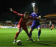 18 October 2024; Sean Gannon of Shelbourne in action against Ryan Burke of Waterford during the SSE Airtricity Men's Premier Division match between Shelbourne and Waterford at Tolka Park in Dublin. Photo by Thomas Flinkow/Sportsfile