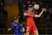 18 October 2024; John Martin of Shelbourne in action against Ryan Burke of Waterford during the SSE Airtricity Men's Premier Division match between Shelbourne and Waterford at Tolka Park in Dublin. Photo by Stephen McCarthy/Sportsfile