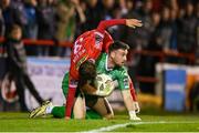 18 October 2024; Waterford goalkeeper Sam Sargeant in action against Tyreke Wilson of Shelbourne during the SSE Airtricity Men's Premier Division match between Shelbourne and Waterford at Tolka Park in Dublin. Photo by Stephen McCarthy/Sportsfile