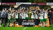 18 October 2024; Cork City captain Cian Coleman lifts the trophy after the SSE Airtricity Men's First Division match between Cork City and Wexford at Turner's Cross in Cork. Photo by Sam Barnes/Sportsfile