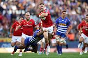 19 October 2024; Shane Daly of Munster is tackled by Warrick Gelant of DHL Stormers during the United Rugby Championship match between DHL Stormers and Munster at DHL Stadium in Cape Town, South Africa. Photo by Shaun Roy/Sportsfile