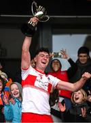 20 October 2024; Carrickcruppen captain Jack Cunningham lifts the trophy after his side's victory in the Armagh County Intermediate Club Football Championship final match between Carrickcruppen and Naomh Pól at BOX-IT Athletic Grounds in Armagh. Photo by Seb Daly/Sportsfile