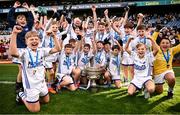 22 October 2024; The Bishop Galvin NS team celebrate with the trophy after the match between Bishop Galvin NS, Dublin and St Mary's BNS, Rathfarnham, Dublin, on day two of the Allianz Cumann na mBunscol Finals at Croke Park in Dublin. Photo by Ramsey Cardy/Sportsfile