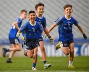 22 October 2024; Arsen Majabageue, left, Freddie Ryan, centre, and Ben Naughton of Holy Cross NS celebrate after the match between Holy Cross NS, Dundrum, Dublin and Sacred Heart NS, Sruleen, Dublin, on day two of the Allianz Cumann na mBunscol Finals at Croke Park in Dublin. Photo by Ramsey Cardy/Sportsfile