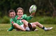 24 October 2024; Charlie Jasinski of Realt Na Mara, right, celebrates with teammate Daire O'Connor after scoring a late try against Bay Estate during a Leinster Rugby Primary School Blitz at Dundalk Rugby Club in Louth. Photo by Ben McShane/Sportsfile