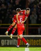 25 October 2024; Shelbourne players Liam Burt and JJ Lunney celebrates their side's second goal, scored by teammate Rayhaan Tulloch, not pictured, during the SSE Airtricity Men's Premier Division match between Shelbourne and Drogheda United at Tolka Park in Dublin. Photo by Seb Daly/Sportsfile