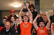 26 October 2024; Clann Éireann captain Conor McConville lifts the trophy after the Armagh County Senior Club Football Championship final match between Clann Eireann and Clan na Gael at the BOX-IT Athletic Grounds in Armagh. Photo by Ramsey Cardy/Sportsfile