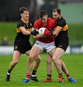 27 October 2024; Barry O'Sullivan of Dingle is tackled by Michael Potts, left, and Daithí Casey of Dr Crokes during the Kerry County Senior Club Football Championship final match between Dingle and Dr Crokes at Austin Stack Park in Tralee, Kerry. Photo by Brendan Moran/Sportsfile