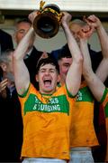 28 October 2024; The Feakle captain Oisín Donnellan lifts the Canon Hamilton Cup after the Clare County Senior Club Hurling Championship final match between Sixmilebridge and Feakle at Cusack Park in Clare. Photo by Ray McManus/Sportsfile