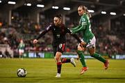 29 October 2024; Salome Gasviani of Georgia in action against Izzy Atkinson of Republic of Ireland during the UEFA Women's EURO 2025 Play-Off Round 1 second leg match between Republic of Ireland and Georgia at Tallaght Stadium in Dublin. Photo by Ben McShane/Sportsfile