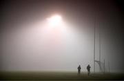 12 November 2024; Officials leave the pitch in heavy fog after the postponement of the AIB Leinster GAA Senior Club Football Championship quarter-final match between St Loman's and Castletown at Lakepoint Park in Mullingar, Westmeath. Photo by Ben McShane/Sportsfile