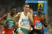 25 August 2004; Ireland's Mark Carroll (2127) leads Dejene Berhanu, left, of Ethiopia and Eliud Kipchoge (2342) of Kenya during his heat of the Men's 5000m in which he failed to qualify for the final. Olympic Stadium. Games of the XXVIII Olympiad, Athens Summer Olympics Games 2004, Athens, Greece. Picture credit; Brendan Moran / SPORTSFILE