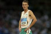25 August 2004; Ireland's Alastair Cragg (2129) after finishing his heat of the Men's 5000m in which he qualified for the final. Olympic Stadium. Games of the XXVIII Olympiad, Athens Summer Olympics Games 2004, Athens, Greece. Picture credit; Brendan Moran / SPORTSFILE