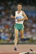 25 August 2004; Ireland's Alastair Cragg crosses the line to finish his heat of the Men's 5000m in which he qualified for the final. Olympic Stadium. Games of the XXVIII Olympiad, Athens Summer Olympics Games 2004, Athens, Greece. Picture credit; Brendan Moran / SPORTSFILE