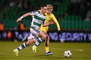 21 November 2024; Aaron McEneff of Shamrock Rovers in action against Pyry Mentu of HJK Helsinki during the club friendly match between Shamrock Rovers and HJK Helsinki at Tallaght Stadium in Dublin. Photo by Ben McShane/Sportsfile