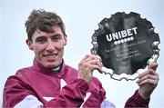 23 November 2024; Jockey Jack Kennedy with the plate after riding Brighterdaysahead to win the Unibet Morgiana Hurdle on day one of the Punchestown Winter Festival at Punchestown Racecourse in Kildare. Photo by David Fitzgerald/Sportsfile