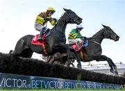 24 November 2024; Fact To File, right, with Mark Walsh up, jumps the last on their way to winning the John Durkan Memorial Punchestown Steeplechase, from eventual third place Galopin Des Champs, left, with Paul Townend up, during day two of the Punchestown Winter Festival at Punchestown Racecourse in Kildare. Photo by Seb Daly/Sportsfile