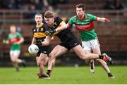 24 November 2024; Charlie Keating of Dr Crokes in action against Jason Curry of Rathgormack during the AIB Munster GAA Senior Club Football Championship semi-final match between Rathgormack and Dr Crokes at Fraher Field in Dungarvan, Waterford. Photo by Michael P Ryan/Sportsfile