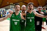 24 November 2024; Ireland players, from left, Conor Quinn, Paul Dick and Roy Downey celebrate after the FIBA Basketball World Cup 2027 European Pre-Qualifiers first round match between Ireland and Kosovo at the National Basketball Arena in Tallaght, Dublin. Photo by Tyler Miller/Sportsfile